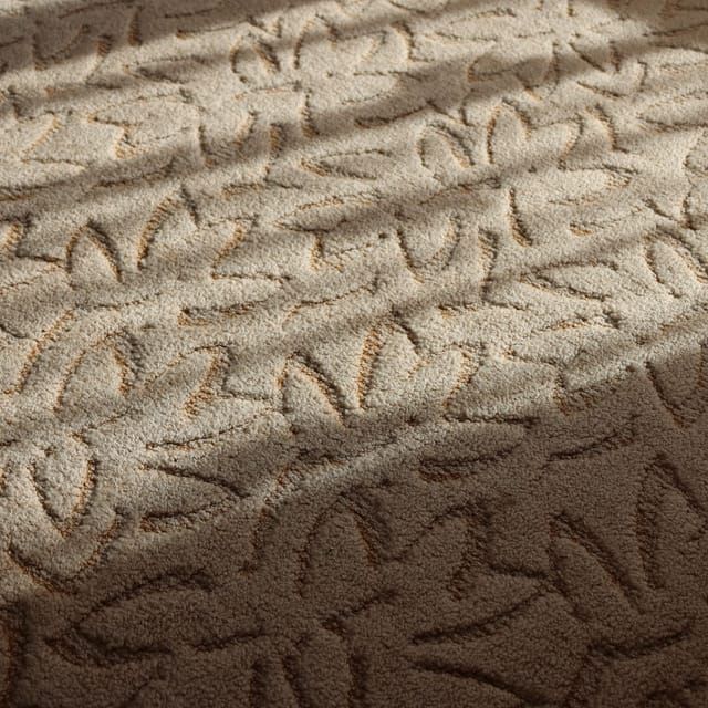 Nahaufnahme eines beigen Teppichbodens mit gemustertem Flor